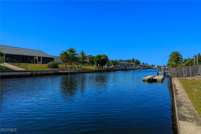 a view of a lake with couches chairs