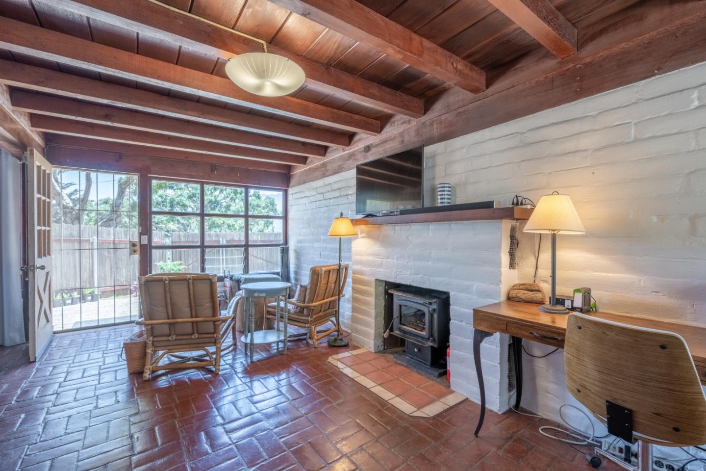 72 Los Laureles Grade Road Carmel Valley, CA 93924 - Photo 35 of 43 a living room with furniture and a fireplace