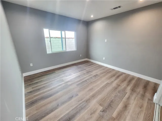 a bathroom with a shower and toilet