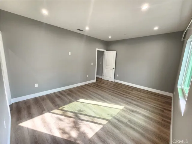 a backyard of a house with lots of green space and garage