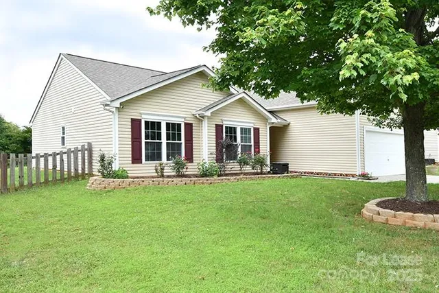 a front view of a house with a yard and porch