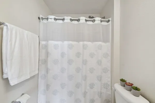 an empty room with a window and wooden floor