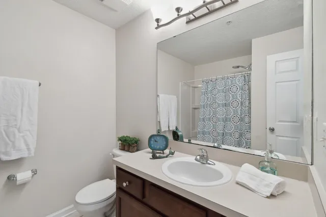 a bathroom with a shower curtain