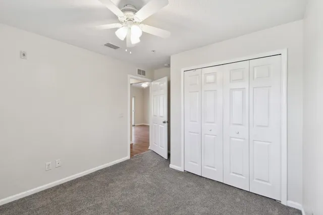 a view of an house with backyard and garden