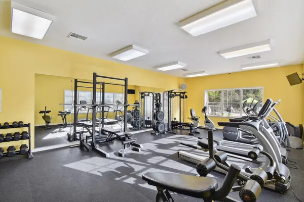 a view of pool with a yard