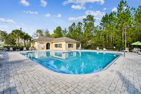 a view of a swimming pool with a patio