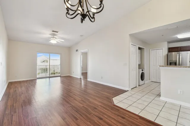 a kitchen with stainless steel appliances granite countertop a refrigerator stove microwave and sink