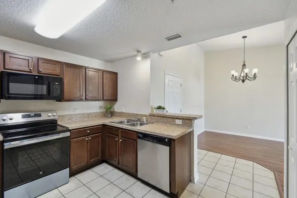 a sink with granite countertop a sink and cabinets