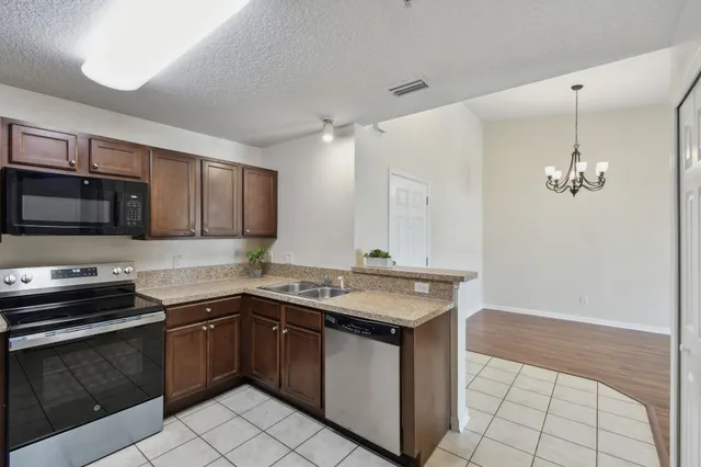 a sink with granite countertop a sink and cabinets