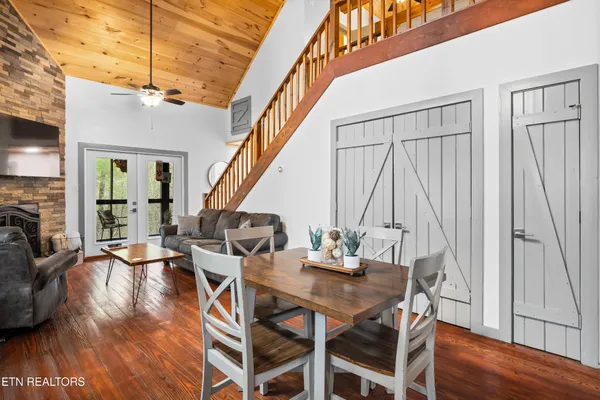 a kitchen with stainless steel appliances a sink cabinets and a window