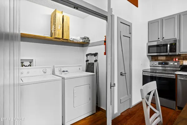 a kitchen with a stove a sink and a refrigerator