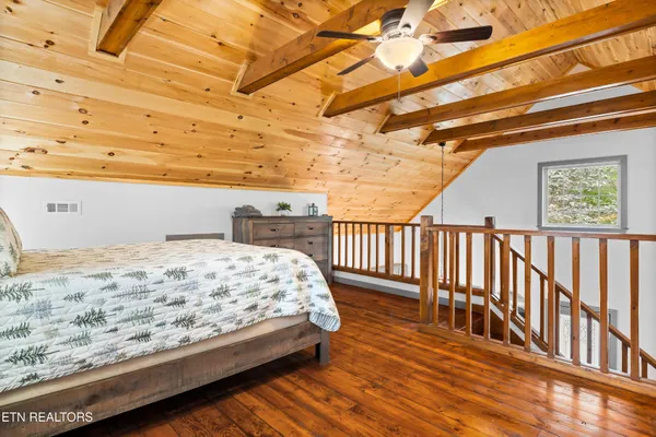 a bathroom with a sink a mirror and a shower curtain