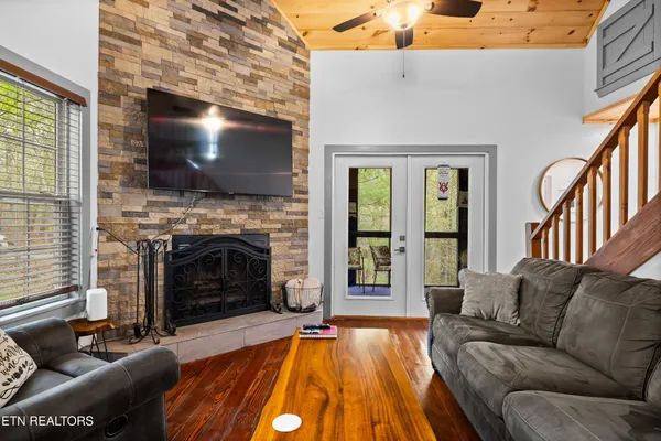 a living room with furniture and a fireplace