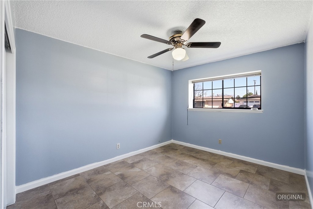 2234 Carter Way Hanford, CA 93230 - Photo 18 of 22 an empty room with wooden floor closet and windows
