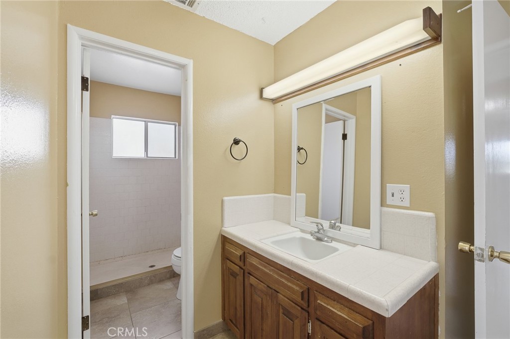 2234 Carter Way Hanford, CA 93230 - Photo 19 of 22 a bathroom with a sink and a mirror