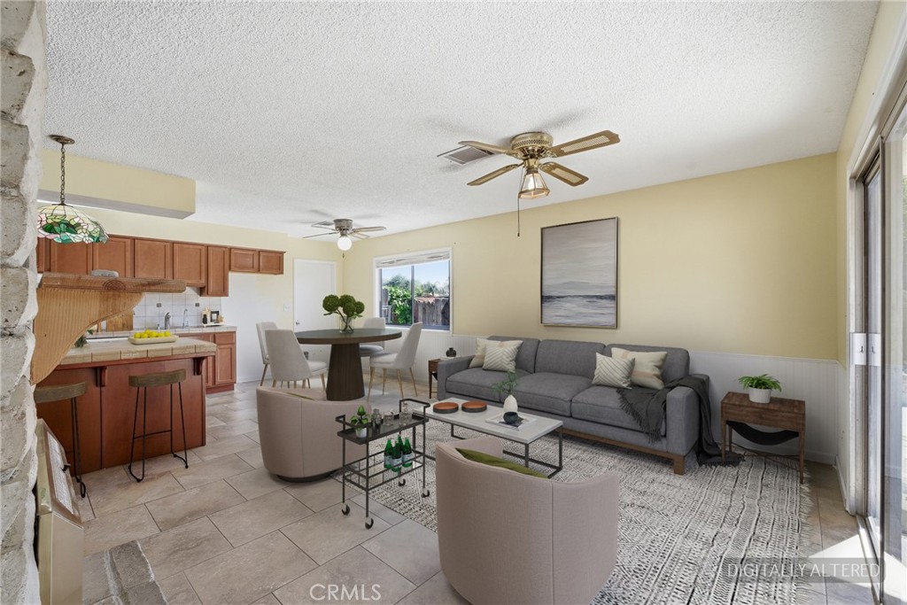 2234 Carter Way Hanford, CA 93230 - Photo 6 of 22 a living room with furniture and a chandelier