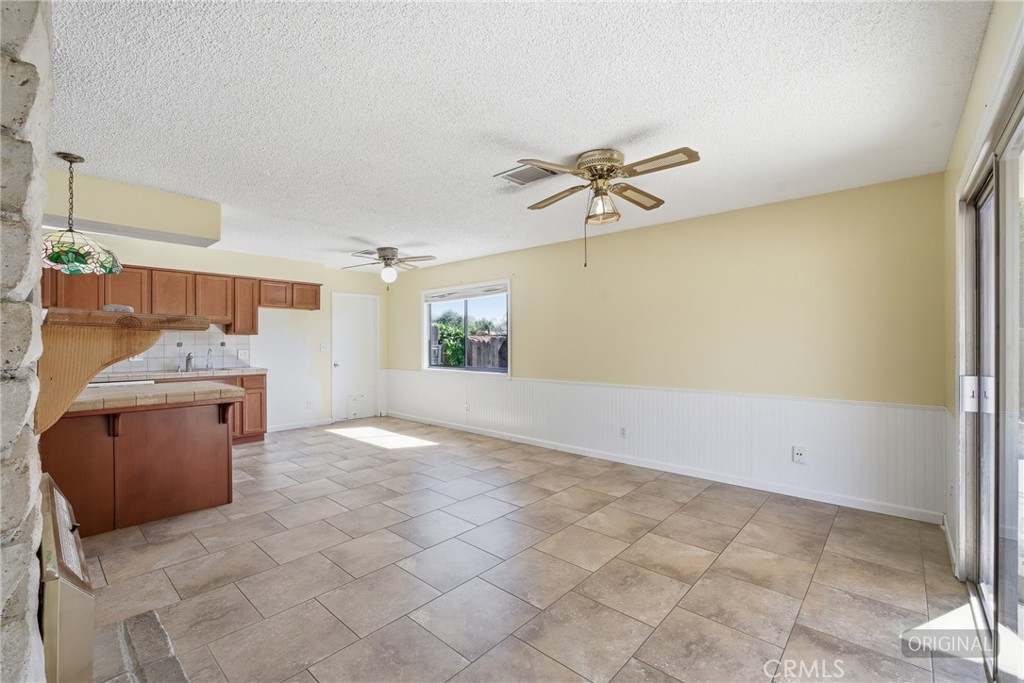 2234 Carter Way Hanford, CA 93230 - Photo 7 of 22 a view of a kitchen with a sink cabinets and a window