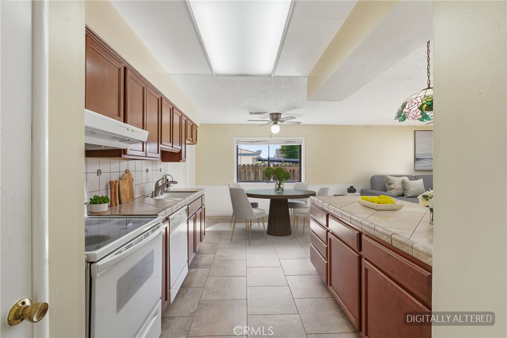 2234 Carter Way Hanford, CA 93230 - Photo 8 of 22 a kitchen with lots of counter top space
