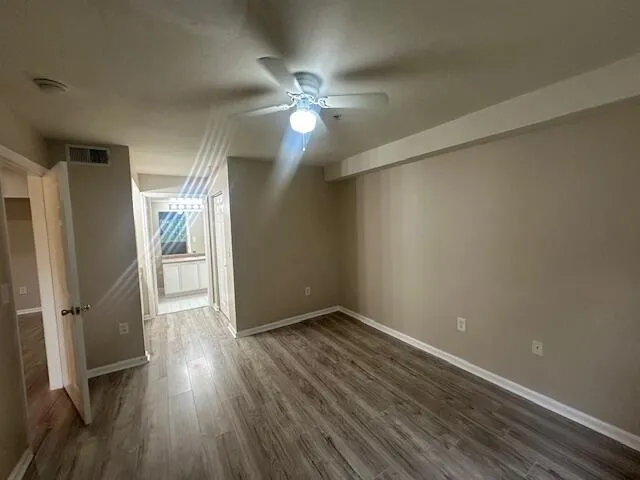 a large bathroom with a large mirror vanity and sink