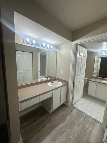 a view of a room with wooden floor