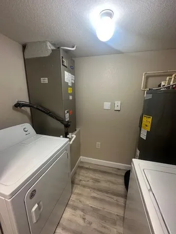 a view of kitchen with furniture and wooden floor