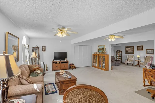 a bedroom with furniture and a chandelier