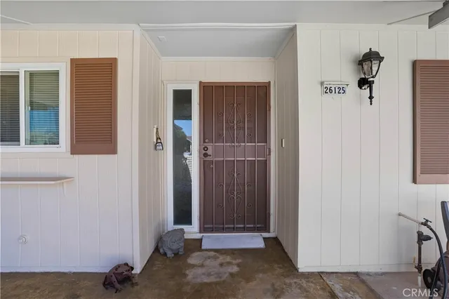 a view of an entryway with wooden floor