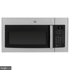 422 Greenlow Road Baltimore, MD 21228 - Photo 34 of 36 New stainless steel microwave being installed 8/31
