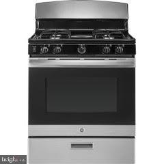 422 Greenlow Road Baltimore, MD 21228 - Photo 36 of 36 New stainless steel stove being installed 8/31
