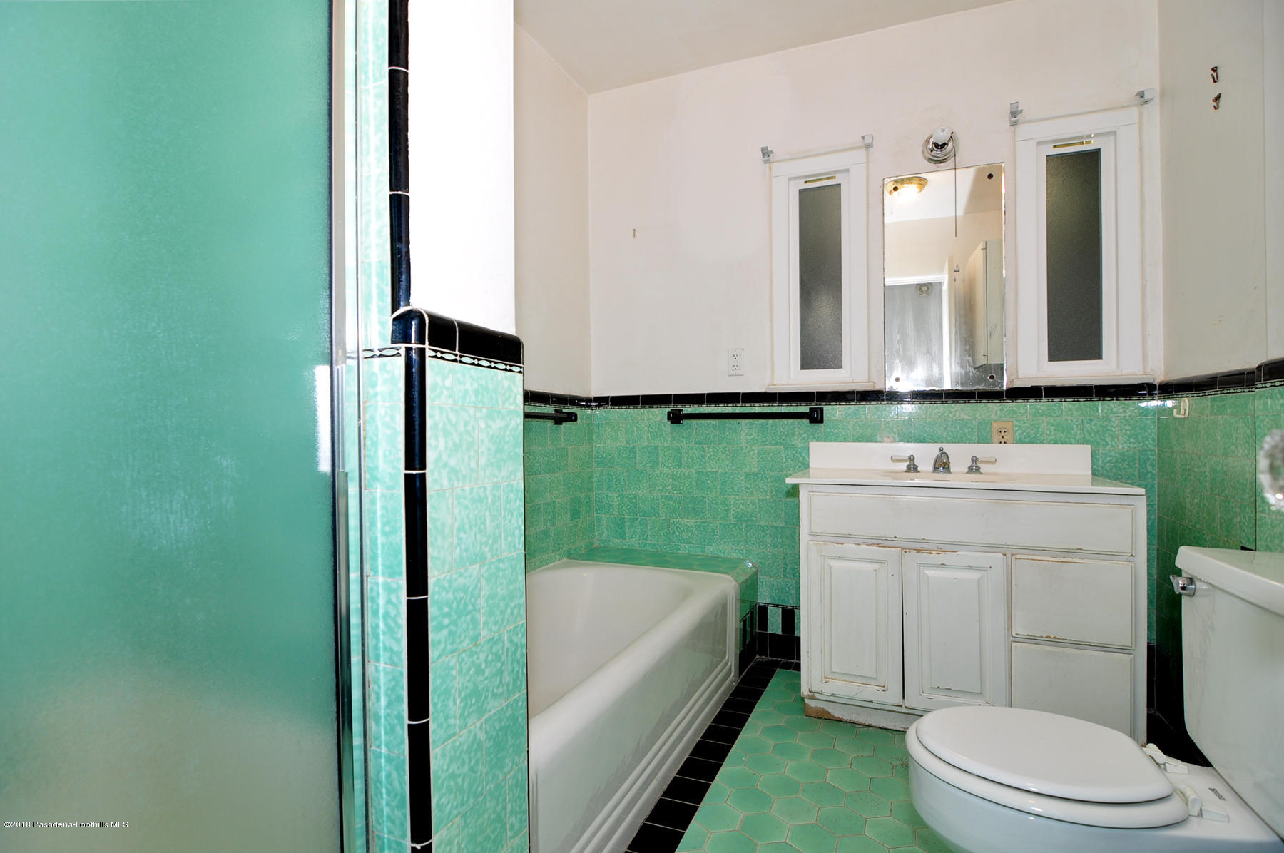 2011 Minoru Drive Altadena, CA 91001 - Photo 12 of 26 a bathroom with a toilet a sink and a bathtub