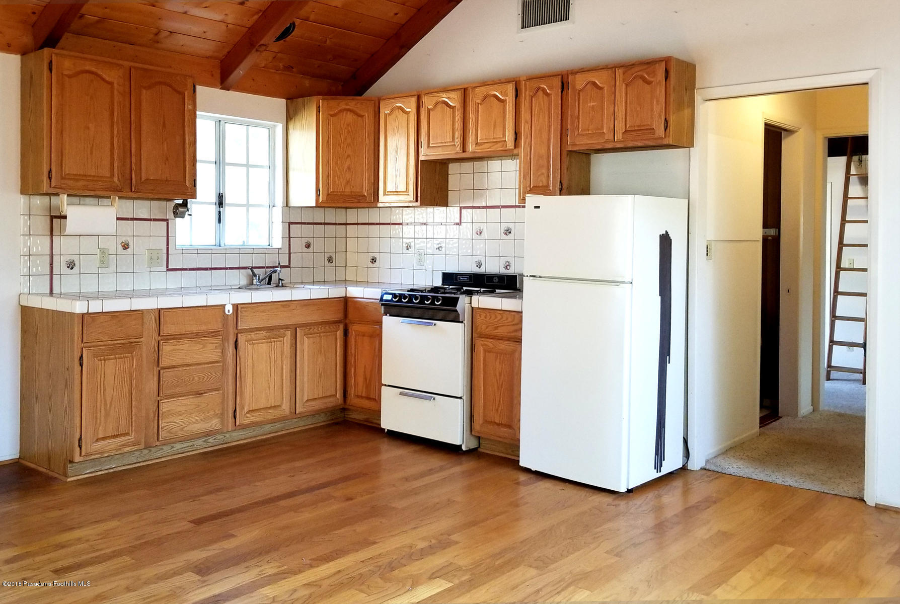 2011 Minoru Drive Altadena, CA 91001 - Photo 17 of 26 a kitchen with appliances a sink and a window