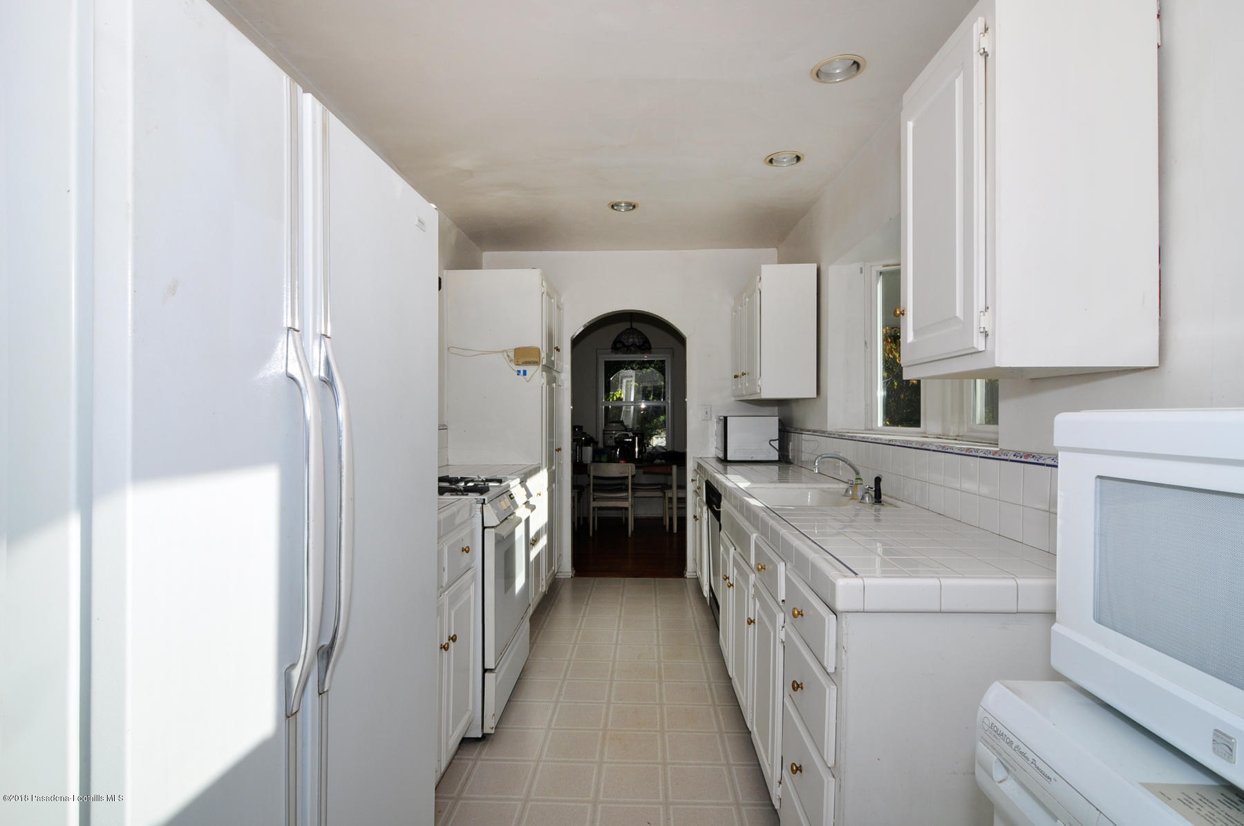 2011 Minoru Drive Altadena, CA 91001 - Photo 6 of 26 a kitchen with a sink and a refrigerator