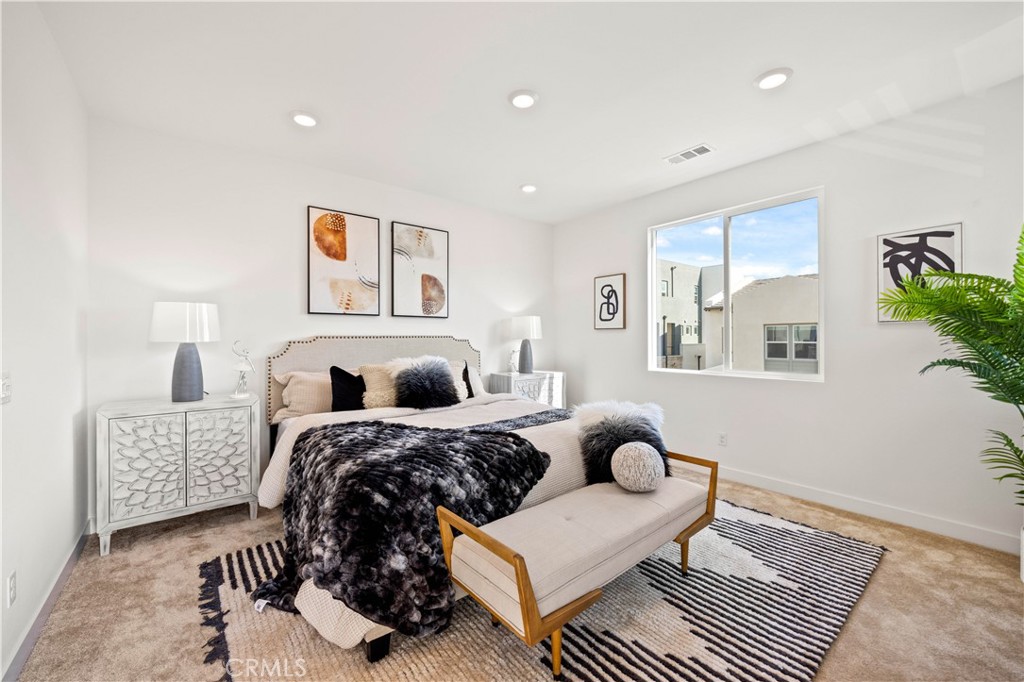 307 Baluster Irvine, CA 92618 - Photo 15 of 29 a bedroom with furniture and a painting on the wall
