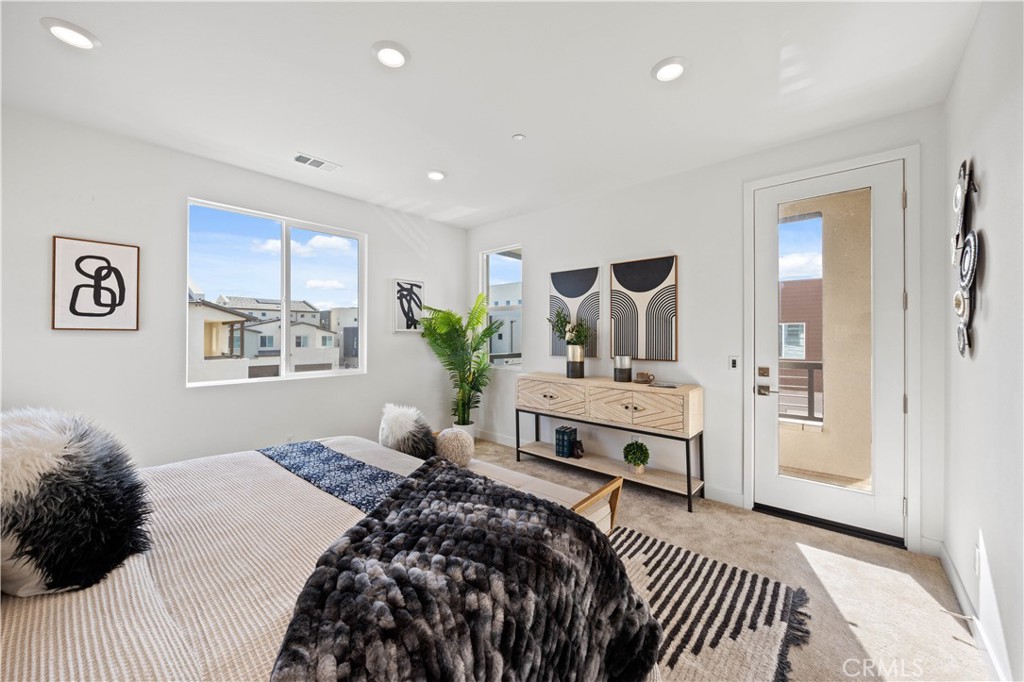307 Baluster Irvine, CA 92618 - Photo 16 of 29 a bedroom with a large bed and a window