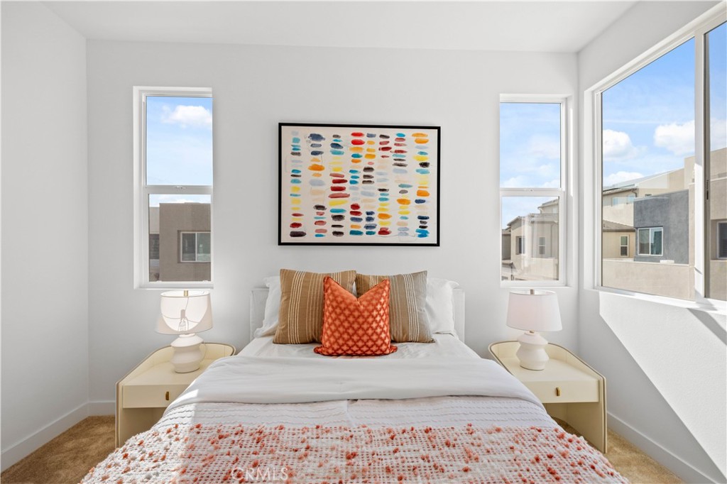 307 Baluster Irvine, CA 92618 - Photo 20 of 29 a bedroom with a large bed and a window