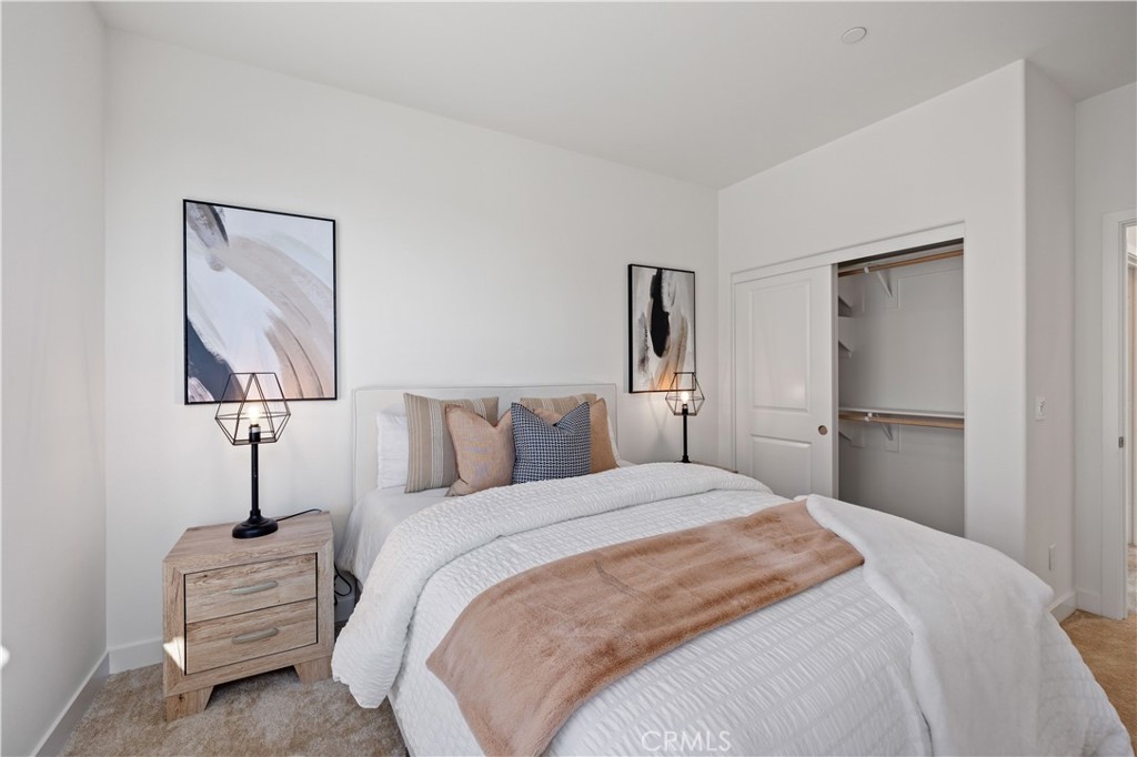 307 Baluster Irvine, CA 92618 - Photo 21 of 29 a bedroom with a bed and a lamp