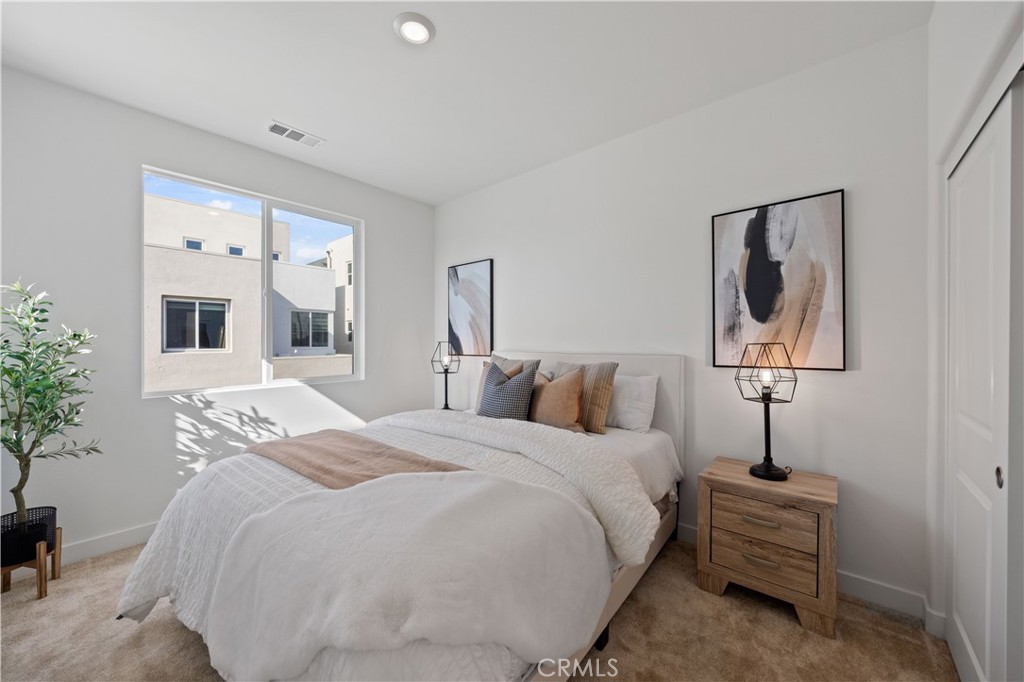 307 Baluster Irvine, CA 92618 - Photo 22 of 29 a bedroom with a bed and a chandelier