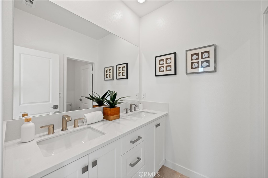307 Baluster Irvine, CA 92618 - Photo 23 of 29 a bathroom with a sink and a mirror