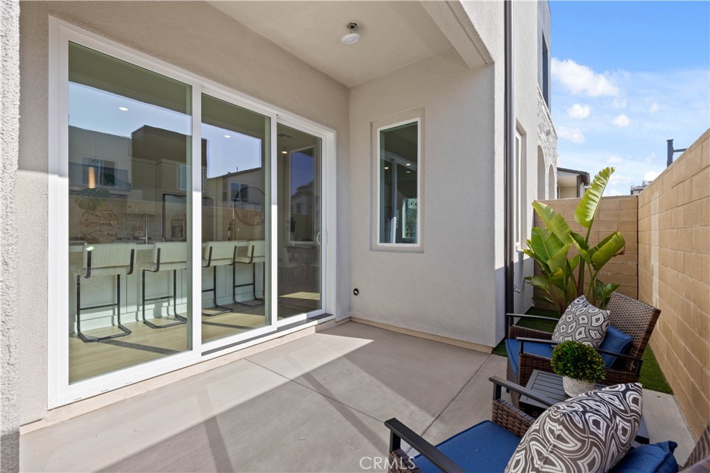 307 Baluster Irvine, CA 92618 - Photo 27 of 29 a living room with furniture and a potted plant