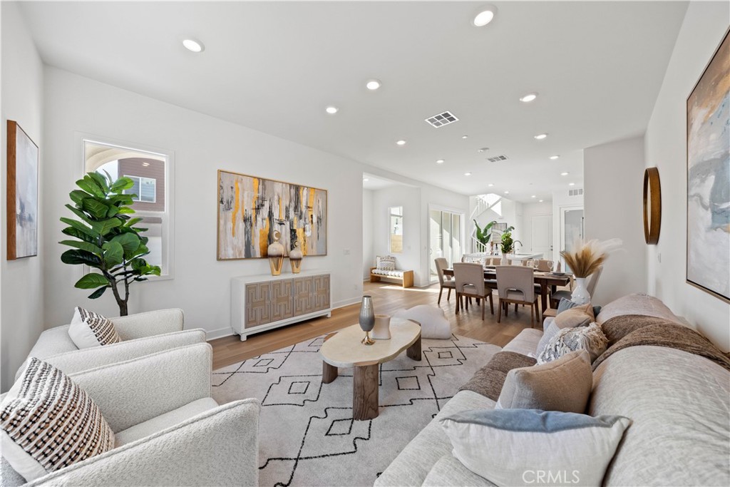 307 Baluster Irvine, CA 92618 - Photo 4 of 29 a living room with furniture potted plant and a large window
