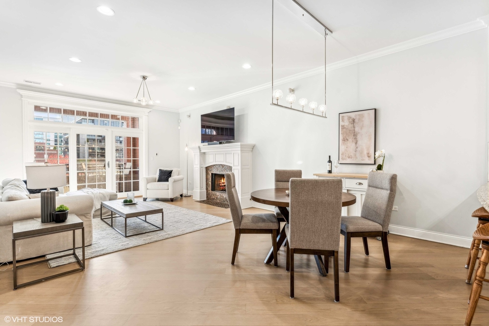 100 South Sangamon Street, Unit 3S Chicago, IL 60607 - Photo 14 of 26 a living room with furniture fireplace and a flat screen tv