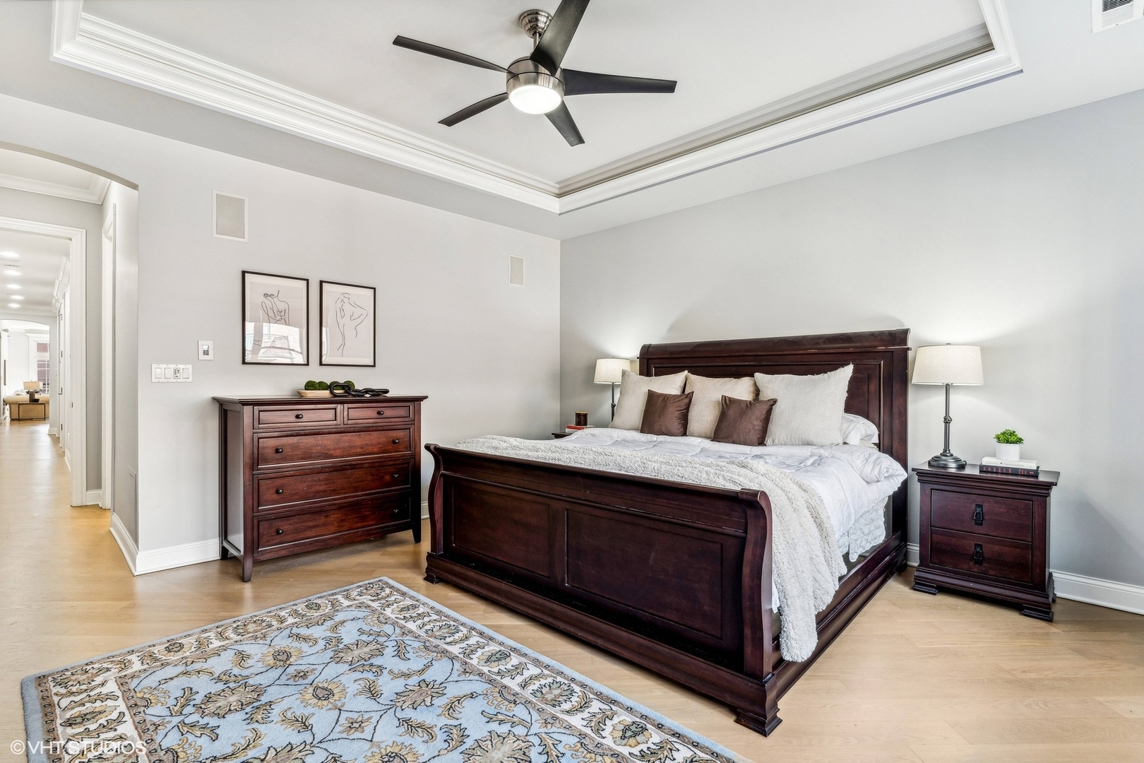 100 South Sangamon Street, Unit 3S Chicago, IL 60607 - Photo 18 of 26 a bedroom with a bed and a chandelier