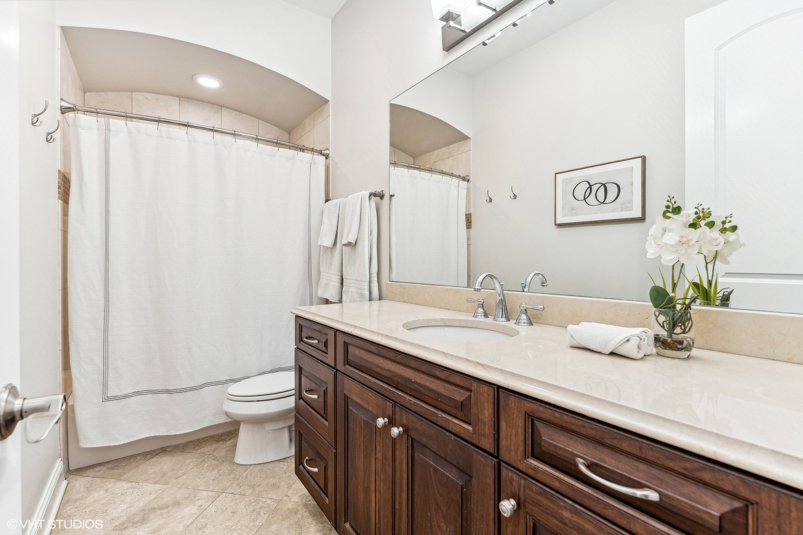 100 South Sangamon Street, Unit 3S Chicago, IL 60607 - Photo 23 of 26 a bathroom with a granite countertop sink a toilet and a mirror