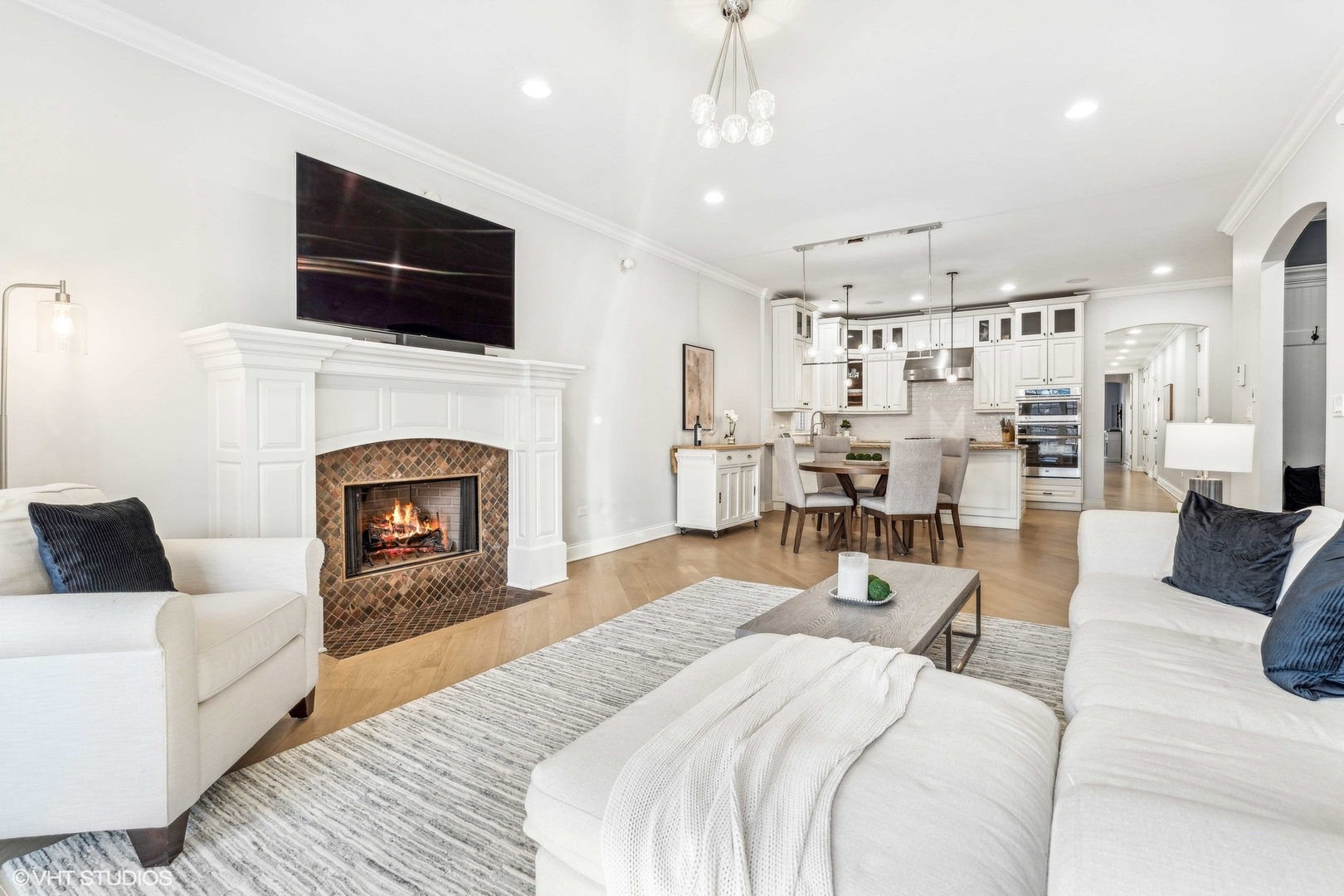 100 South Sangamon Street, Unit 3S Chicago, IL 60607 - Photo 7 of 26 a large bedroom with furniture fireplace and flat screen tv