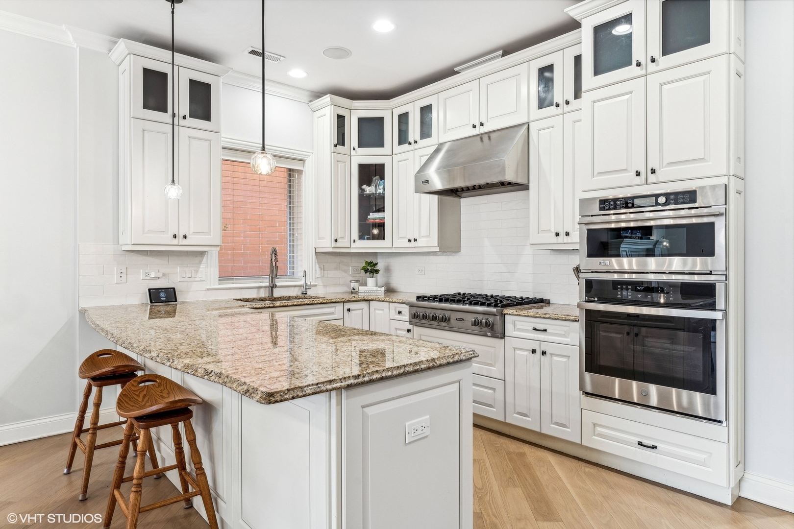 100 South Sangamon Street, Unit 3S Chicago, IL 60607 - Photo 8 of 26 a kitchen with stainless steel appliances granite countertop a stove and a sink