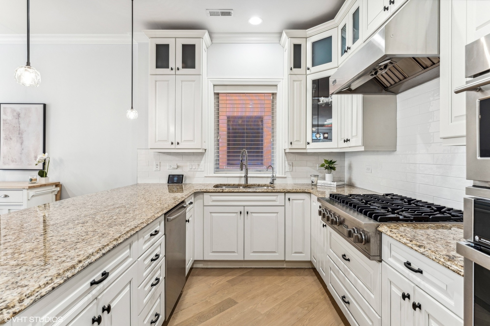 100 South Sangamon Street, Unit 3S Chicago, IL 60607 - Photo 9 of 26 a kitchen with granite countertop a sink stove and cabinets