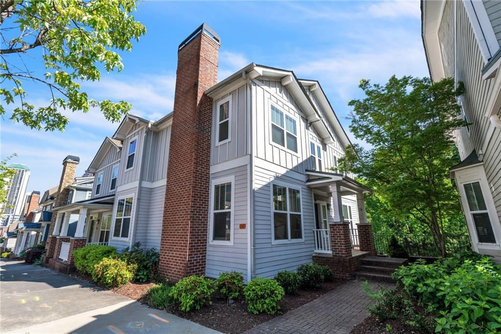 242 16th Street Northwest, Unit 14 Atlanta, GA 30363 - Photo 1 of 31 a front view of a house with a yard