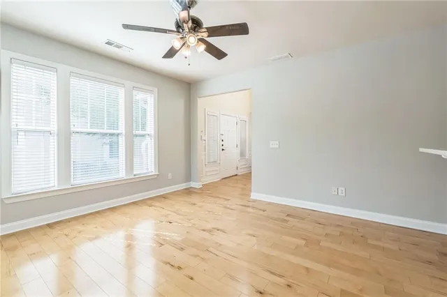 a view of an empty room with a window