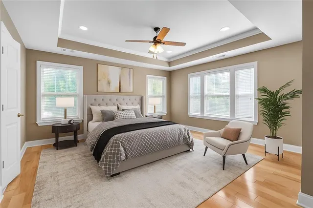 a bedroom with a bed chair and window