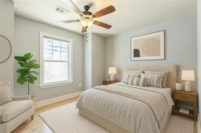 a bedroom with a bed and furniture